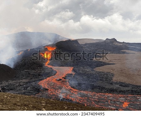 Volcano Lava Eruption with black rocks and red fire in Iceland hot magma burst smoke field doom Crater