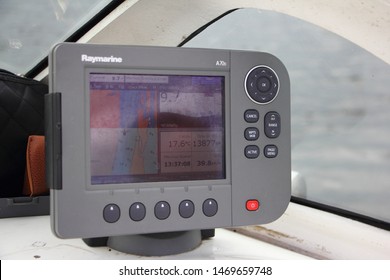 Volga River, Kimry, Tver Region / Russia - 07 14 2019: Close-up Grey Modern Chartplotter Device Raymarine A70d On Motor Boat Dashboard, Inscription On Screen In Russian Local Time, Depth, Map, Trip