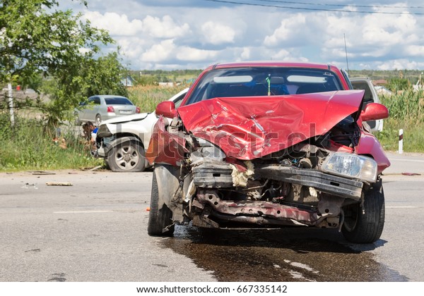 VOLGOGRAD - JUNE 19: Road accident on a country\
road between the crossover and the red sedan without casualties.\
June 19, 2017 in Volgograd,\
Russia.