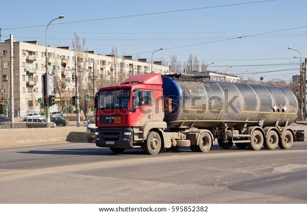 VOLGOGRAD - MARCH 5: A truck with a tank for\
transportation of petroleum products rises on the bridge. March 5,\
2017 in Volgograd,\
Russia.