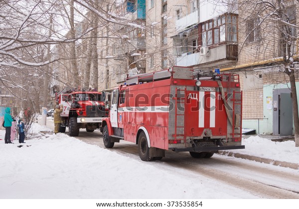 Volgograd, Russia - January 24, 2016:\
Two cars Fire Service of EMERCOM of Russia arrived to the challenge\
on suspicion of fire in high-rise apartment\
building