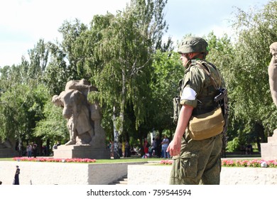 VOLGOGRAD, RUSSIA - June 15, 2017: One soldier on the city street weapon clear day