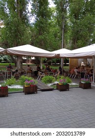Volgograd, Russia - May 23, 2021: Summer terraces of a cafe and restaurant on the street Heroes Alley in the city center.
