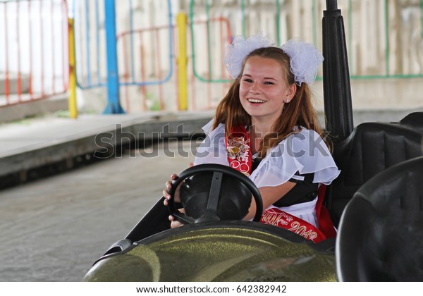 Volgograd, Russia - May 25,\
2013: Girl in school uniform, the bows and the ribbon \