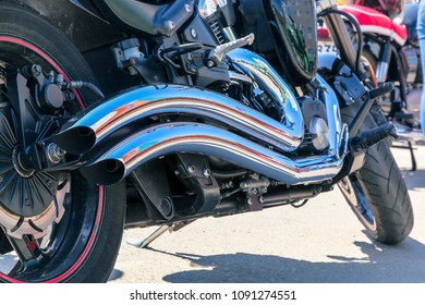 VOLGOGRAD, RUSSIA - May 5,2018: Chromic exhaust pipe, motorcycle wheel close up - Shutterstock ID 1091274551