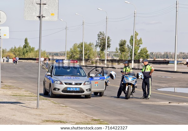 VOLGOGRAD - SEPTEMBER 9: Road patrol and\
inspection service of the police official car and motorcycle.\
September 9 2017 in Volgograd\
Russia.
