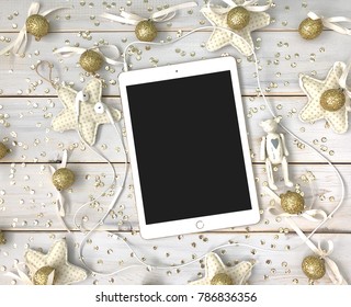 VOLGOGRAD.RUSSIA - 20 DECEMBER 2017.Wooden Christmas Background With IPad Pro, Christmas Tree, Bird And Gold Glitter