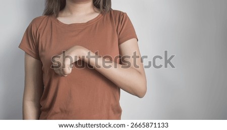 Volkmann contracture affecting the left upper limb of a young Southeast Asian woman. Permanent shortening of the forearm muscles, resulting in a claw like deformity of the hand, fingers, and wrist.