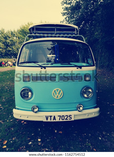 Volkswagen Camper -\
23rd of August 2018 - Selsey, West Sussex, United Kingdom. VW\
Volkswagen camper van in Retro blue. Front of camper van and pop up\
roof. Vintage retro\
Volkswagen.