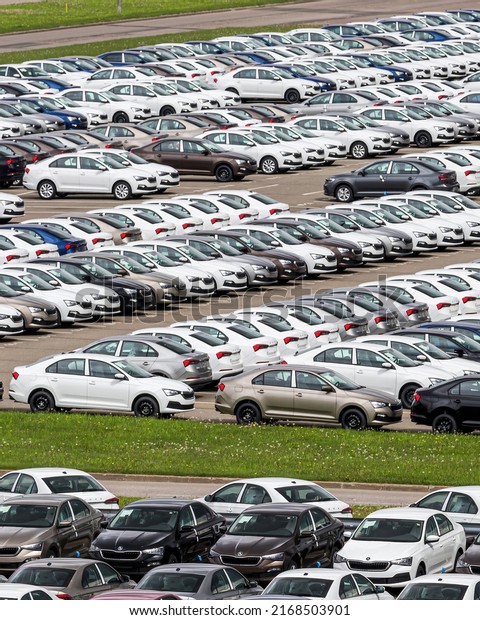 Volkswagen Group Rus, Russia, Kaluga - MAY 25,\
2020: Rows of a new cars parked in a distribution center on a car\
factory parking.