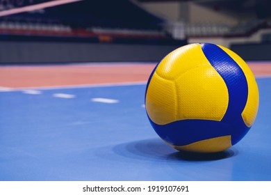Volleyball ball on blurred wooden parquet background. Banner, space for text, close up view with details. - Shutterstock ID 1919107691
