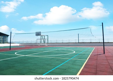 Volleyball court with net on sunny day