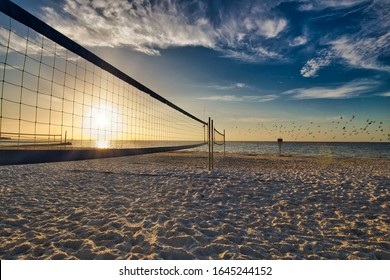A volleyball court at North Shore Park in St. Petersburg, Fl as the sun is rising over Tampa Bay.