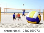 Volleyball game on sandy beach 