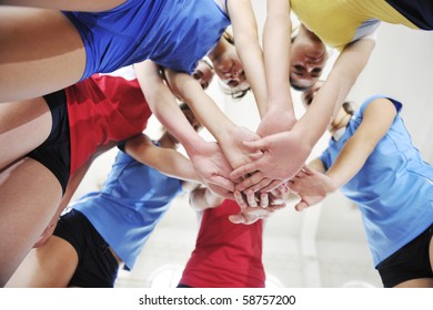 Volleyball Game Sport With Group Of Young Beautiful  Girls Indoor In Sport Arena