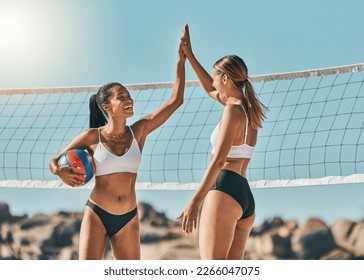 Volleyball, high five and winner with sports woman celebrating a win on the beach during summer. Teamwork, friends and goal with a female team in celebration of victory after a game while on vacation - Powered by Shutterstock