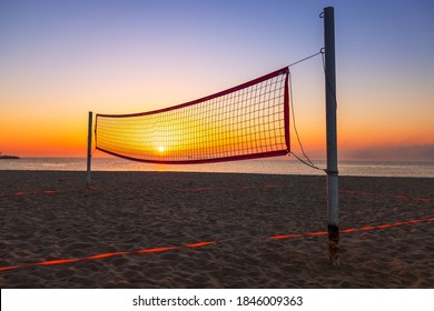 Volleyball net and beautiful sunrise on the beach 