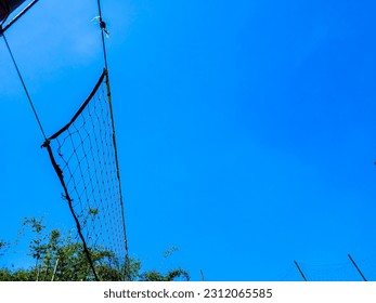 Volleyball net with blue sky background - Shutterstock ID 2312065585