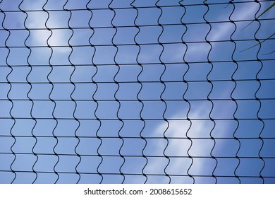 Volleyball Net Silhouette With Blue Sky And Light Clouds