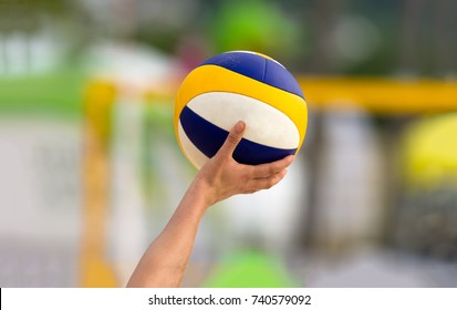 Volleyball Is A Volleyball Player Holding Up A Volleyball Getting Ready To Serve.