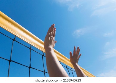 Volleyball Spike Hand Block Over The Net. Close-up Reach For Ball