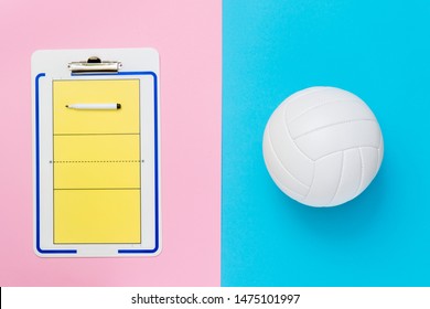 Volleyball and tactical board with marker on pink and blue background. Top view - Powered by Shutterstock