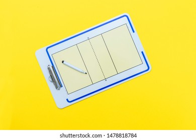 Volleyball tactical board with marker on yellow background. Top view - Powered by Shutterstock