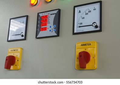 Volt and amp meter switching button on electric control panel.
