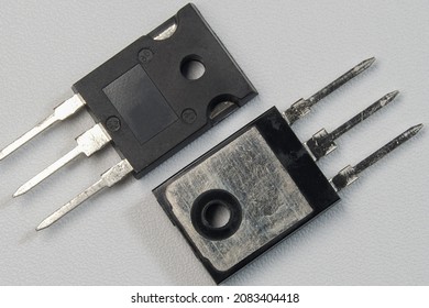 Voltage regulator transistor for power supply. Black transistor on white background isolated.