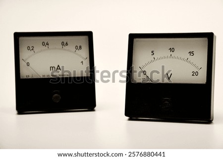 Voltmeter and ammeter on a white background. A means of measuring electric current and voltage.