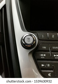 Volume And Power On Button With Chrome On Car Stereo Entertainment System Beside Vent.