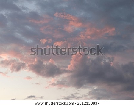Volumetric storm clouds with reflections from the setting sun