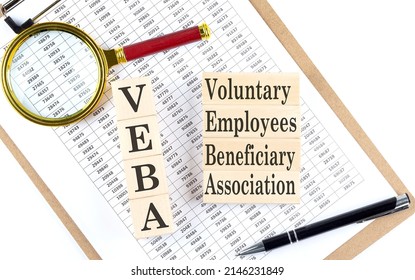 Voluntary Employees Beneficiary Association Plan VEBA text on a wooden block on chart background - Shutterstock ID 2146231849