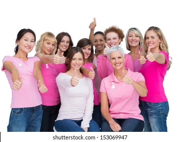 Voluntary women posing on white background and wearing pink for breast cancer - Powered by Shutterstock