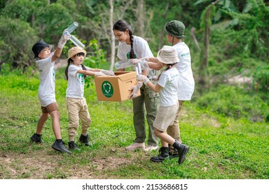 Volunteer Asian and children are collecting plastic bottles into garbage box to reduce global warming and environmental pollution. Volunteering and recycling concept.
 - Shutterstock ID 2153686815