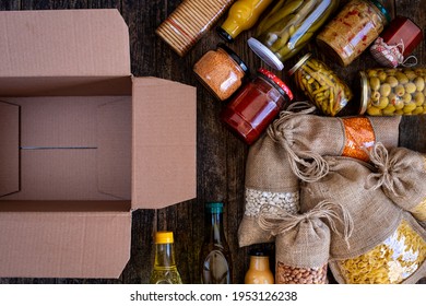 Volunteer with box of food for poor . Ramazan kolisi . Donation concept . Many foods in the package.  - Shutterstock ID 1953126238