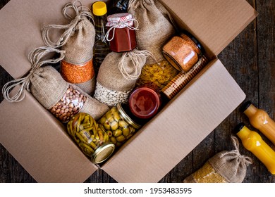 Volunteer with box of food for poor . Ramazan kolisi . Donation concept . Many foods in the package.  - Shutterstock ID 1953483595