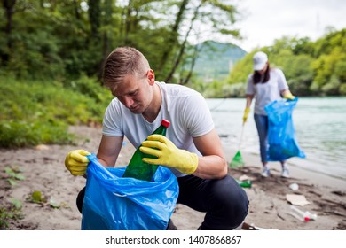 Volunteer Cleaning Garbage Near River