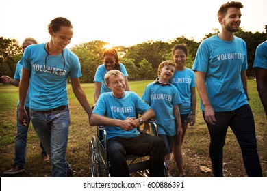 Volunteer Group Of People For Charity Donation In The Park