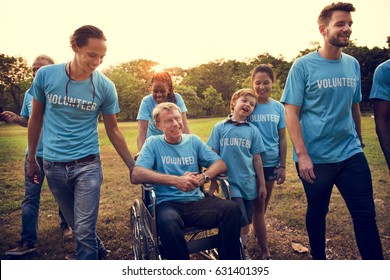 Volunteer Group Of People For Charity Donation In The Park