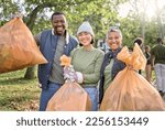 Volunteer group portrait, community service and cleaning park with garbage bag for clean environment. Happy man and women helping with trash for eco friendly lifestyle and recycling outdoor in nature