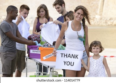  volunteer group saying thank you for clothing donation - Powered by Shutterstock