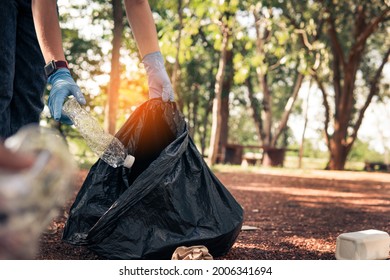 Volunteer holding plastic garbage Clean to dispose of waste properly. - Shutterstock ID 2006341694