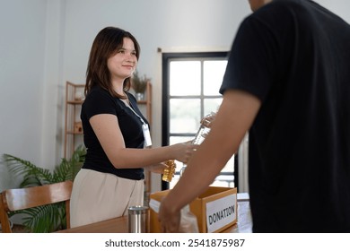 Volunteer Interaction While Preparing Aid Packages for Community Relief - Powered by Shutterstock