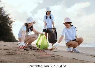 Volunteer picking up garbage activity on the beach after tourist resting in holidays weekend travel people lifestyle. - Powered by Shutterstock