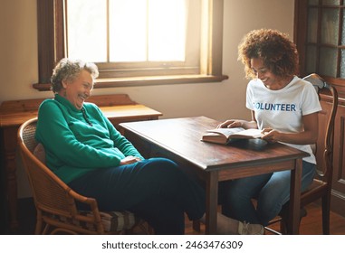 Volunteer, reading and senior woman in nursing home for community service, social responsibility or outreach project. NGO, elderly person with helper for knowledge, happiness or literature book - Powered by Shutterstock