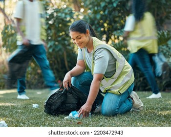 Volunteer, recycle pollution cleaning charity group working together to collect trash for sustainability. Community support, sustainable and eco friendly people help to clean park grass outdoor - Powered by Shutterstock