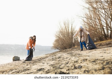 Volunteer Team Cleaning Up Rubbish From The Beach