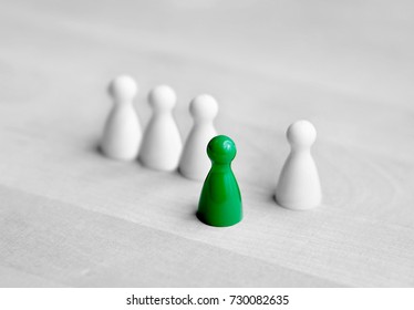 Volunteering, courage and being initiative or spontaneous concept. Dare to be different. One board game pawn stand in front from the crowd. - Shutterstock ID 730082635
