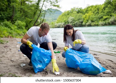 Volunteers Cleaning Garbage Near Riverside Stock Photo 1500637304 ...